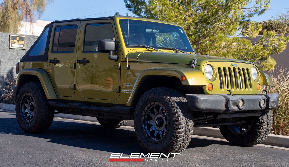 18 inch Dirty Life 9301 Roadkill Matte Gunmetal w/ Black Beadlock on a 2008 Jeep Wrangler JK Sahara
