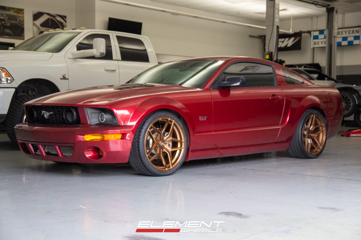 Staggered Variant Xenon in Brushed Bronze on a 2005 Ford Mustang GT