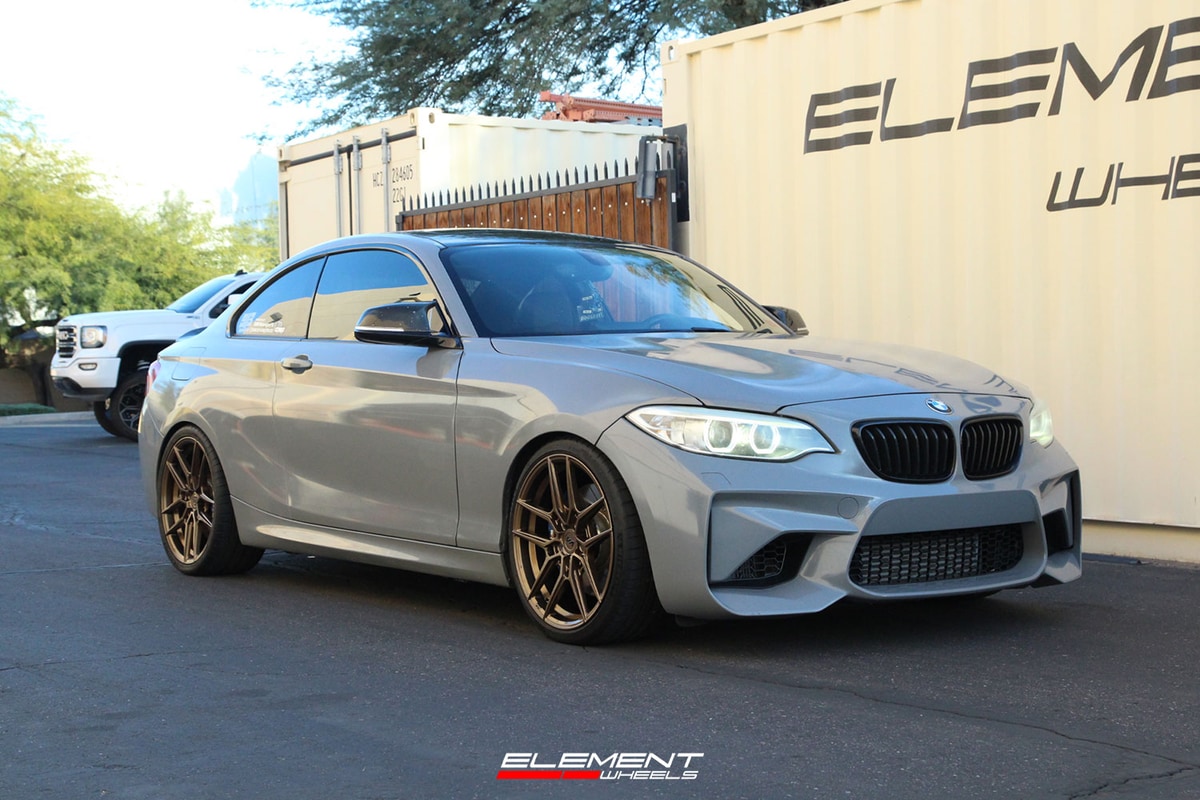 19 inch Staggered Offset Variant Helium Gloss Bronze on a 2015 BMW M235i