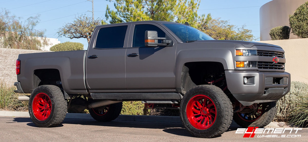 22 Inch XD Surge Lollipop Red (custom) on 2016 Chevrolet Silverado 2500 Lifted