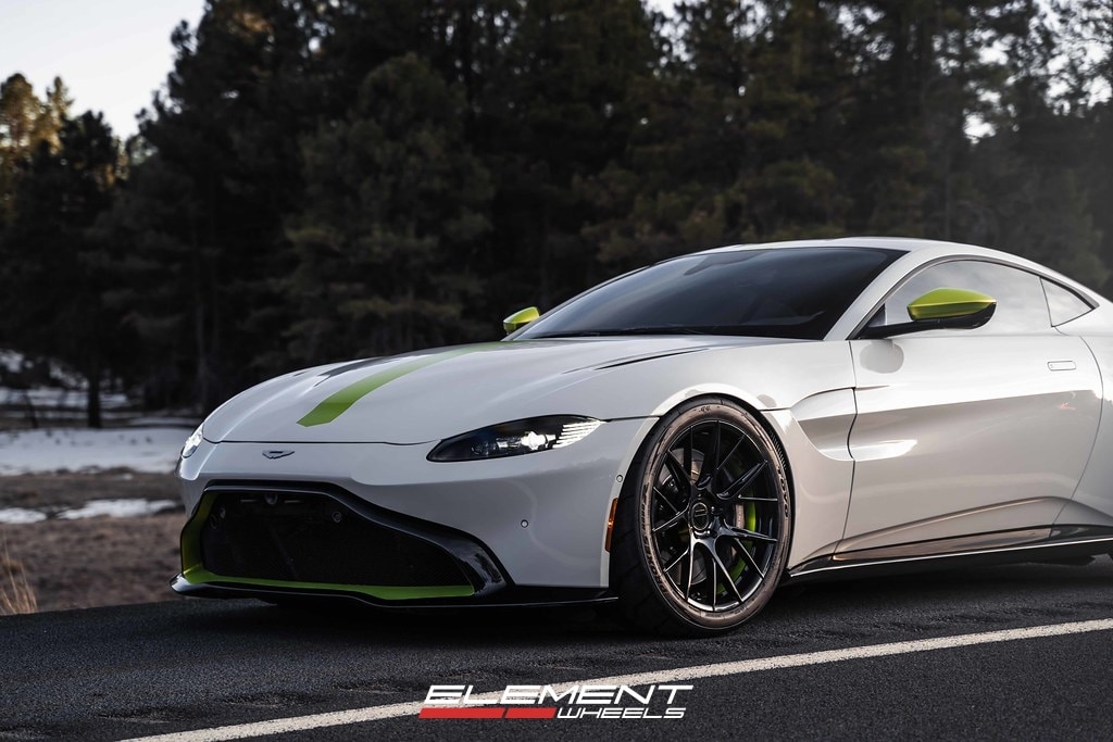 20 inch Staggered Blaque Diamond BD-F18 Gloss Black w/ Shocker Yellow Barrel on a 2019 Aston Martin Vantage