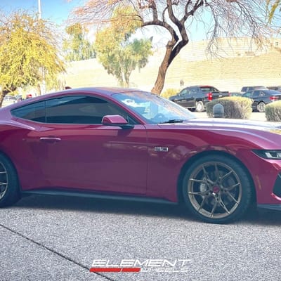 Staggered 20 inch Variant Nysa in Gloss Bronze on a 2024 Ford Mustang GT