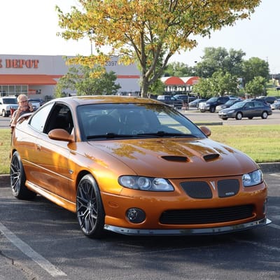 Staggered 19 inch Avant Garde M520R in Dark Graphite Metallic on a 2006 Pontiac GTO