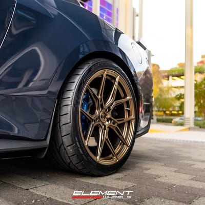 Staggered 20 inch Variant Nysa in Gloss Bronze on a 2024 Ford Mustang Dark Horse