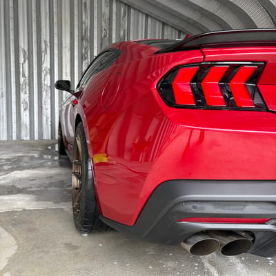 Staggered 19 inch Variant Zeno in Gloss Bronze on a 2024 Ford Mustang 5.0 S650
