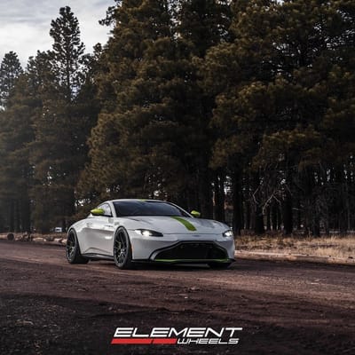 20 inch Staggered Blaque Diamond BD-F18 Gloss Black w/ Shocker Yellow Barrel on a 2019 Aston Martin Vantage