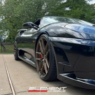 20 inch Staggered Variant Helium Gloss Bronze on a 2007 Ferrari F430