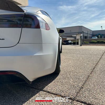 Staggered 21 inch Variant Formula Satin Black Center, Gloss Black Outer, Blue Fasteners on a 2021 Tesla Model S