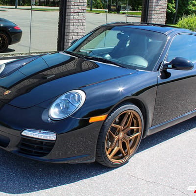 Staggered 19 Inch Variant Xenon in Brushed Bronze on a 2009 Porsche 911 C2
