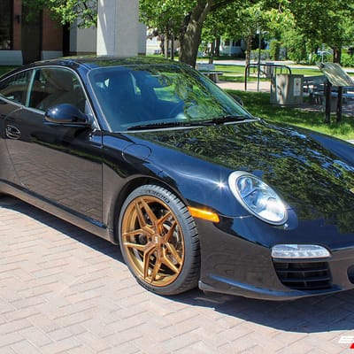 Staggered 19 Inch Variant Xenon in Brushed Bronze on a 2009 Porsche 911 C2