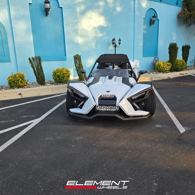 Staggered 20 inch Lexani Savage in Gloss Black on a 2021 Polaris Slingshot