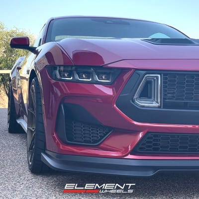 Staggered 20 inch Variant Nysa in Gloss Bronze on a 2024 Ford Mustang GT