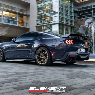 Staggered 20 inch Variant Nysa in Gloss Bronze on a 2024 Ford Mustang Dark Horse