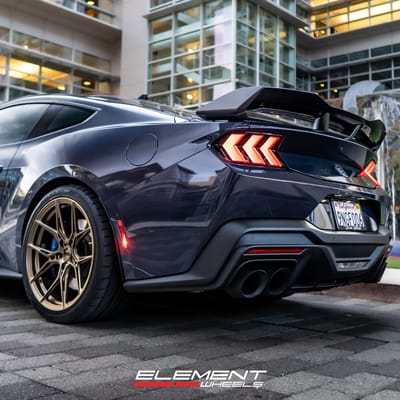 Staggered 20 inch Variant Nysa in Gloss Bronze on a 2024 Ford Mustang Dark Horse