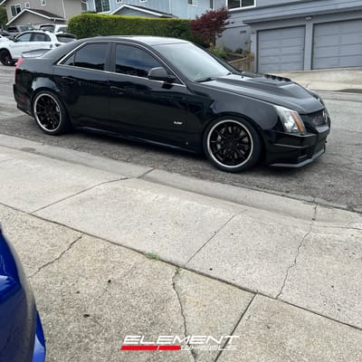 Staggered 20 inch Ferrada CM2 in Matte Black on a 2009 Cadillac CTS-V