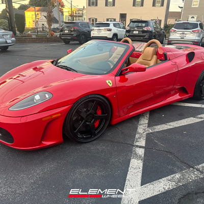 Staggered 20 inch Variant Sena in Gloss Black on a 2009 Ferrari F430