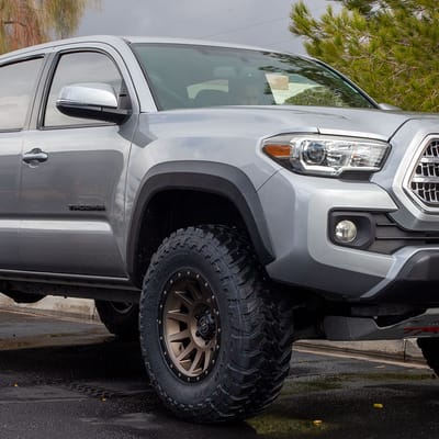 17 inch Icon Compression Bronze on a 2016 Toyota Tacoma w/ 2.5" level kit