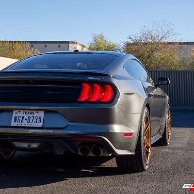 20 inch Staggered Variant Xenon Brushed Bronze w/ Blood Red Center Cap on a 2019 Ford Mustang GT