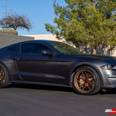 20 inch Staggered Variant Xenon Brushed Bronze w/ Blood Red Center Cap on a 2019 Ford Mustang GT
