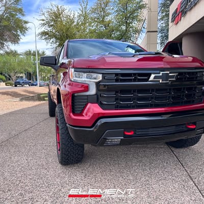 22 inch Fuel Off-Road Catalyst Matte Black w/ Candy Red Lip on a 2024 Chevrolet Silverado 1500 Trail Boss