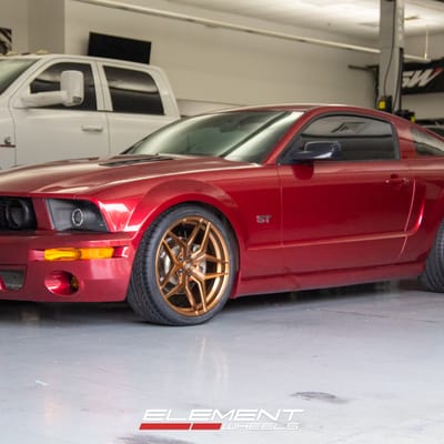 Staggered Variant Xenon in Brushed Bronze on a 2005 Ford Mustang GT