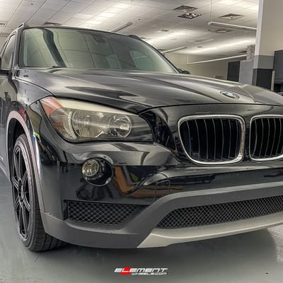 18 inch Motegi MR142 Satin Black on a 2014 BMW X1