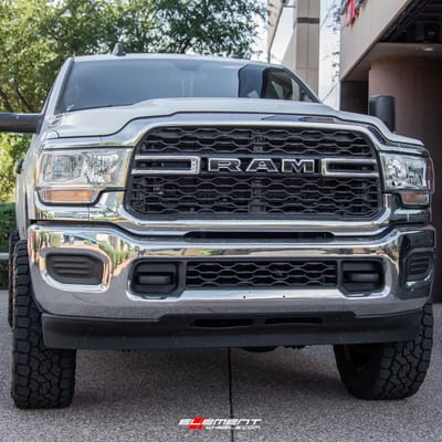 20 inch Cali Off-Road Summit 9110 Gloss Black w/ Blue Milled Spokes on a Leveled 2021 Dodge Ram 2500 HD
