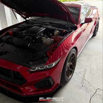 Staggered 19 inch Variant Zeno in Gloss Bronze on a 2024 Ford Mustang 5.0 S650