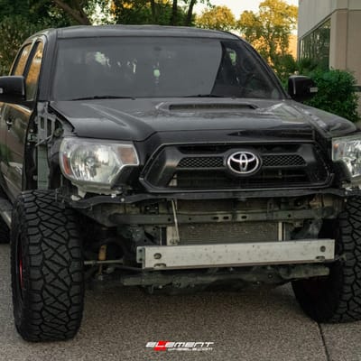 17 inch Black Rhino Riot Beadlock Candy Red w/ Black Ring & Bolts on a Leveled 2013 Toyota Tacoma