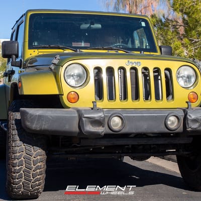 18 inch Dirty Life 9301 Roadkill Matte Gunmetal w/ Black Beadlock on a 2008 Jeep Wrangler JK Sahara