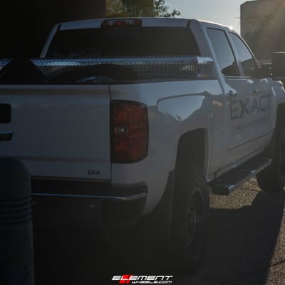 18 Inch Fuel Off-Road Crush Gloss Black Double Dark Tint D561 on a 2019 Chevrolet 2500