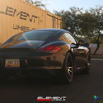 19 inch Staggered Savini Black Di Forza BM12 Gloss Black w/ Machined Face on a 2010 Porsche Cayman