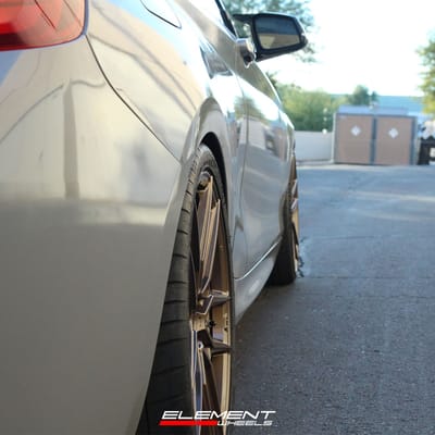 19 inch Staggered Offset Variant Helium Gloss Bronze on a 2015 BMW M235i