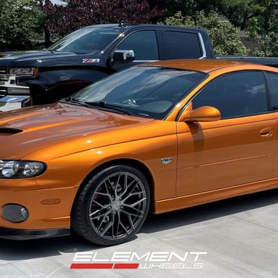 Staggered 19 inch Avant Garde M520R in Dark Graphite Metallic on a 2006 Pontiac GTO
