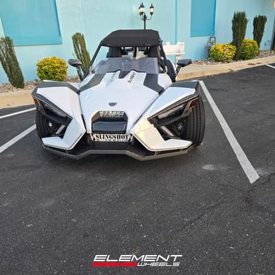 Staggered 20 inch Lexani Savage in Gloss Black on a 2021 Polaris Slingshot