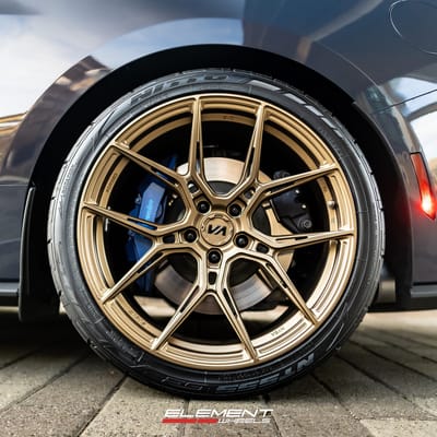 Staggered 20 inch Variant Nysa in Gloss Bronze on a 2024 Ford Mustang Dark Horse