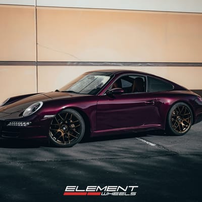 Staggered 19 Inch Ruger Mesh Matte Triple Bronze (Custom) on a 2007 Porsche 911 Carrera 997 Base Narrowbody