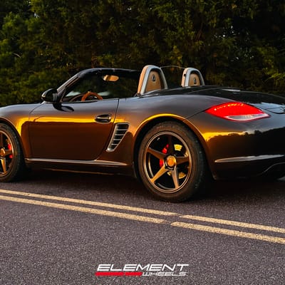 Staggered 19 inch Variant Sena in Gloss Bronze on a 2010 Porsche Boxster S