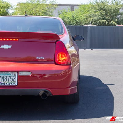 18 Inch Motegi MR142 Satin Black W/ Red Stripe on a 2007 Chevrolet Monte Carlo SS