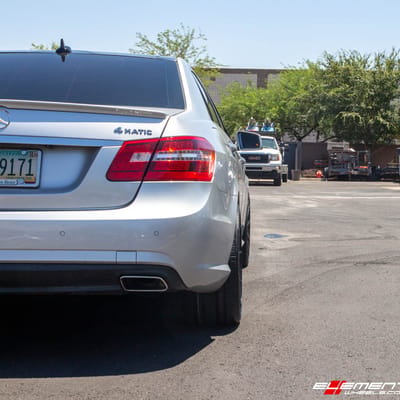 Staggered 20 Inch Variant Argon in Gloss Piano Black on a 2013 Mercedes Benz E550 Sedan