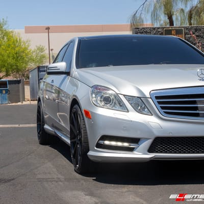 Staggered 20 Inch Variant Argon in Gloss Piano Black on a 2013 Mercedes Benz E550 Sedan