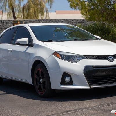 16 Inch Motegi MR116 In Black w/ Red Stripe on a 2015 Toyota Corolla