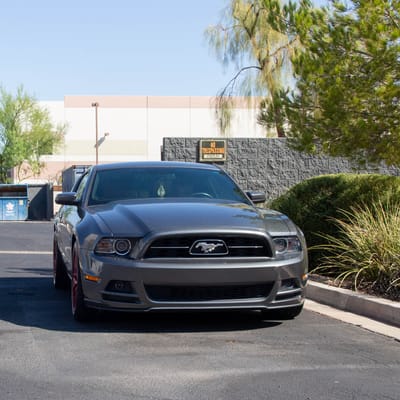 Staggered 18 Inch F1R F103 in Candy Red on a 2011 Ford Mustang Base