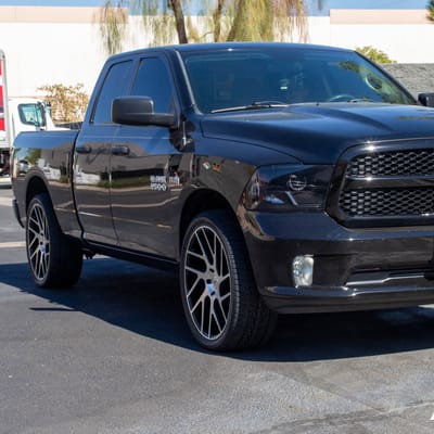 24 Inch Status Juggernaut in Gloss Black Machined on a 2015 Dodge Ram 1500