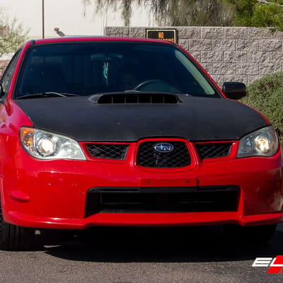 18 Inch Motegi MR116 Black W/Red Stripe on a 2006 Subaru Impreza