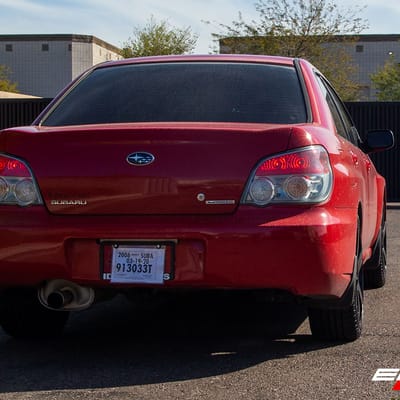 18 Inch Motegi MR116 Black W/Red Stripe on a 2006 Subaru Impreza