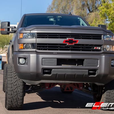 22 Inch XD Surge Lollipop Red (custom) on 2016 Chevrolet Silverado 2500 Lifted