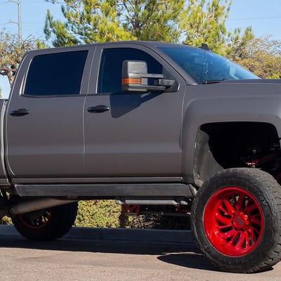 22 Inch XD Surge Lollipop Red (custom) on 2016 Chevrolet Silverado 2500 Lifted