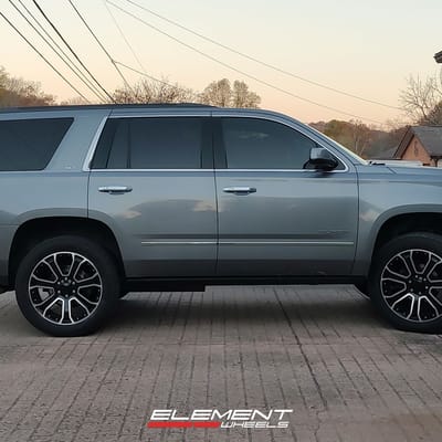 22 Inch Factory Reproductions FR49 in Gloss Black Machined Face on a 2018 GMC Yukon