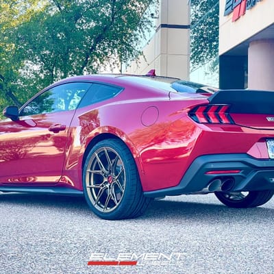 Staggered 20 inch Variant Nysa in Gloss Bronze on a 2024 Ford Mustang GT